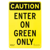 Black and yellow sign reading, "Caution enter on green only."