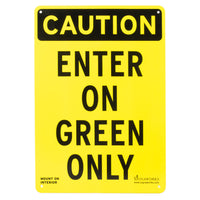 Black and yellow sign reading, "Caution enter on green only."
