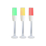 Diffused pole-mounted tower light on flange mount, demonstrating color options; Green-Amber-Red on white background.