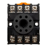 Black plastic plate with orange clip on top and 8 labeled wire terminals.