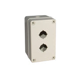 Light grey push button box with two holes; held together with 4 phillips head screws on a white background.