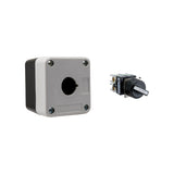 Grey and black single push button box held together by four phillips head screws next to a black and white 2-position selector switch on a white background.