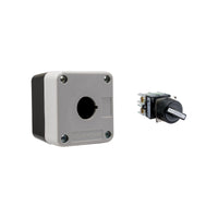 Grey and black single push button box held together by four phillips head screws next to a black and white 2-position selector switch on a white background.