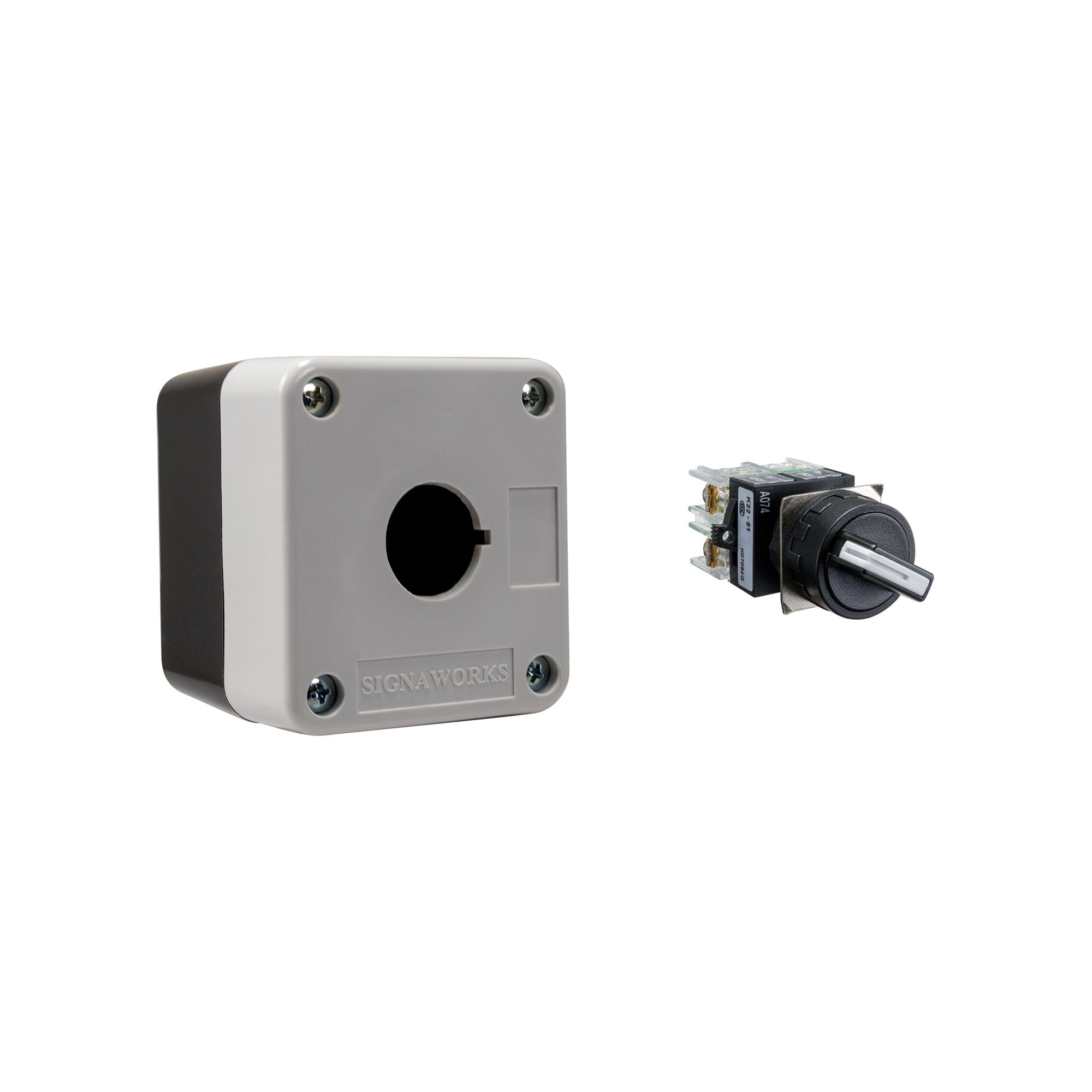 Grey and black single push button box held together by four phillips head screws next to a black and white 2-position selector switch on a white background.