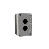 Grey front quarter perspective of a dual push button enclosure with two mounting holes and four phillips head screws holding the enclosure together on a white background.