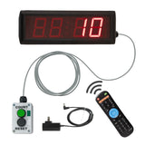 Digital display with red LED numbers, control box, remote control, and power adapter on a white background.