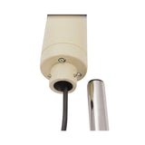 Detail close up photo of LED light with steel pole and black power wiring on a white background.