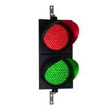 A 12 inch diameter LED traffic light with red and green lenses.