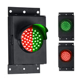 A 4 inch diameter 2-in-1 lens LED stop-go loading dock traffic light with red and green colors, showing both states of the light in different images, mounted on a black housing with mounting brackets.