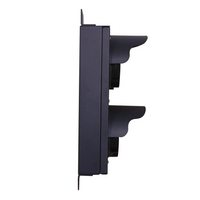Side perspective of black aluminum traffic light powered off.