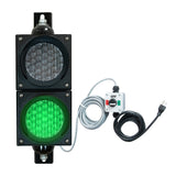 Traffic light system with green LED light, control box and cables on a white background.
