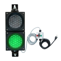 Traffic light system with green LED light, control box and cables on a white background.