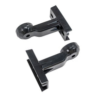 Two black plastic wall-mounted brackets on a white background.