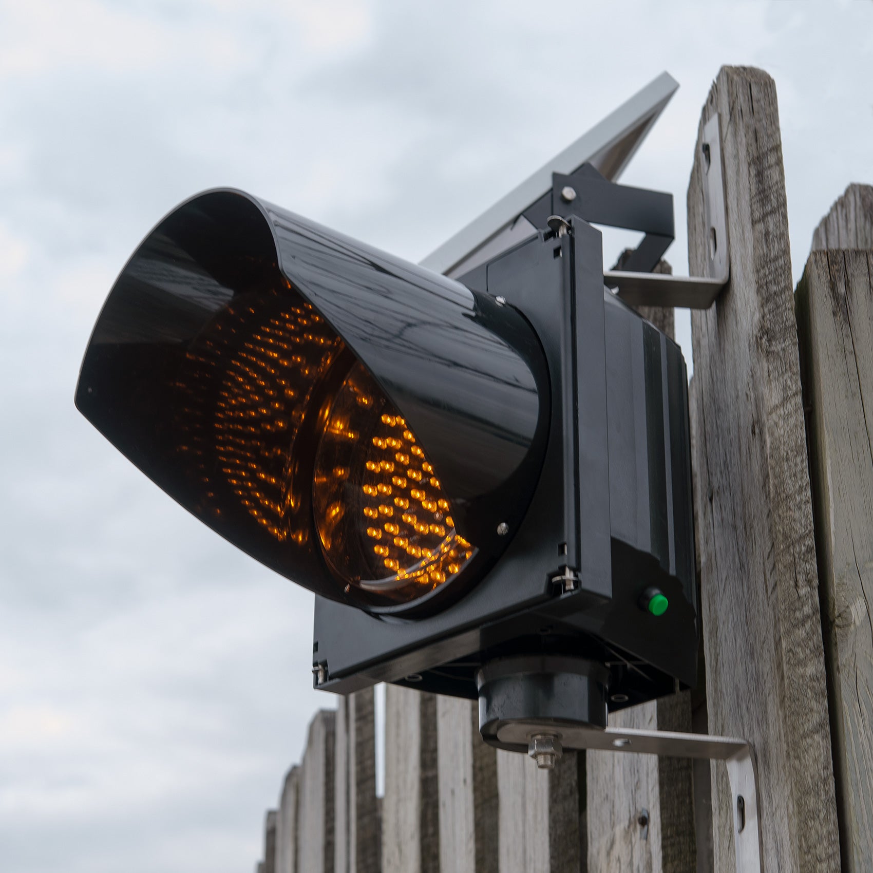 Solar powered 8 inch traffic light mounted outdoors.