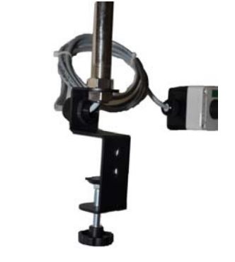 Black c-clamp style black desk lamp on a white background.