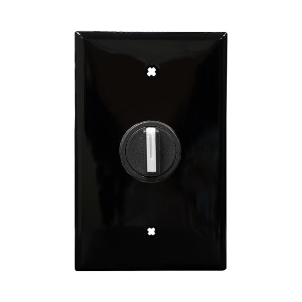 A black wall plate 3-Position selector switch mounted on a white wall, with a central black dial for changing positions.