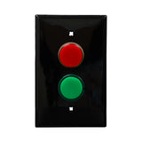 Black wall plate with red and green LED pilot light switch on a white background.