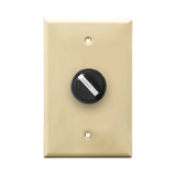 A ivory wall plate and black 2-position selector switch mounted on a white wall plate on a white background.